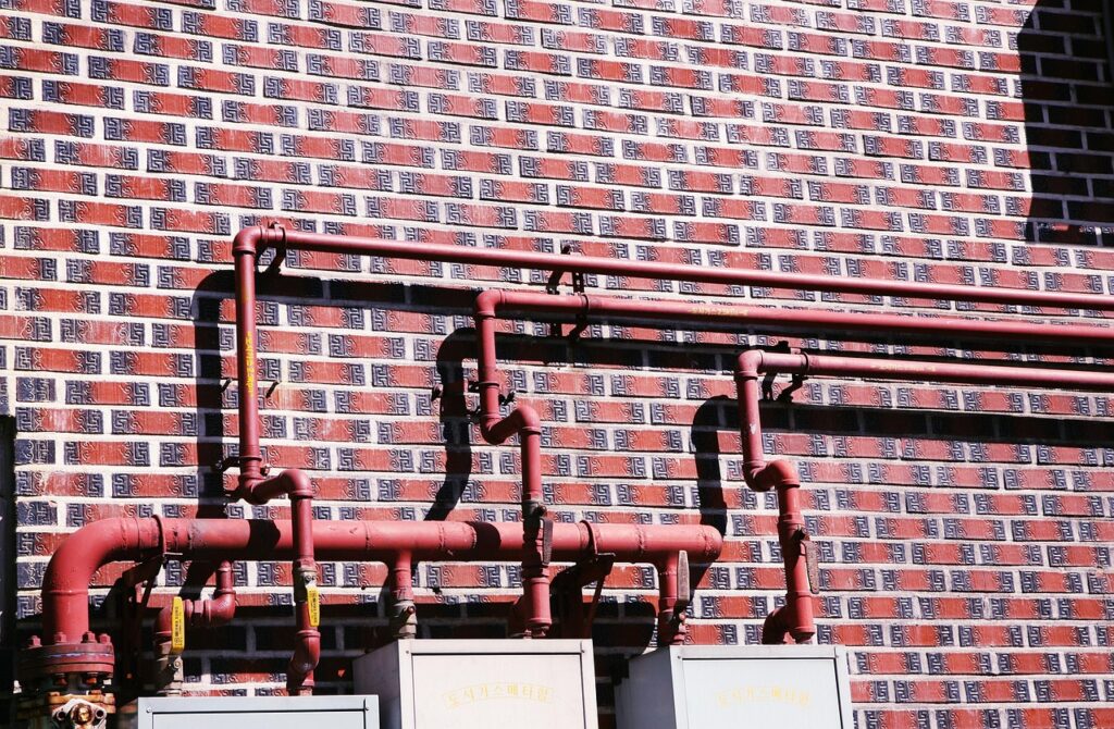 pipes on a brick house