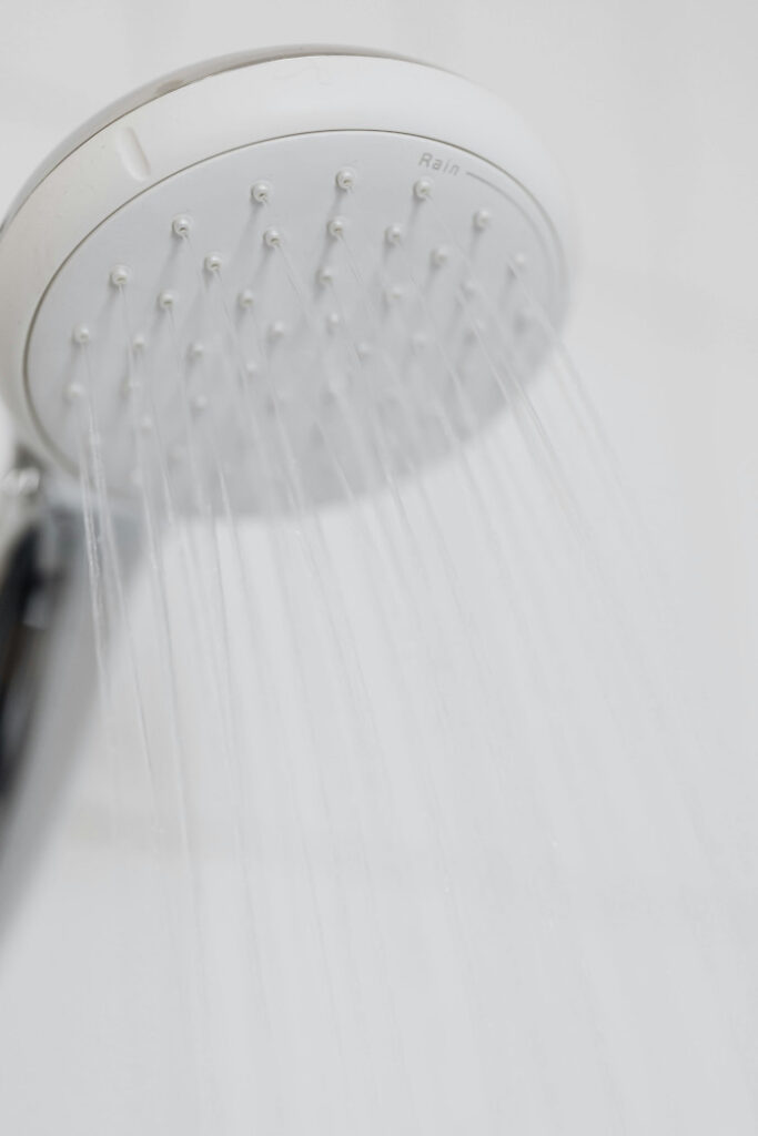 white shower head turned on